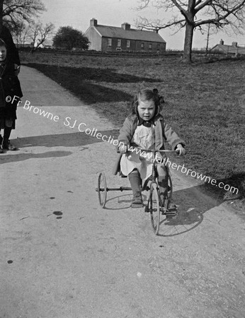 CHILD ON TRIKE